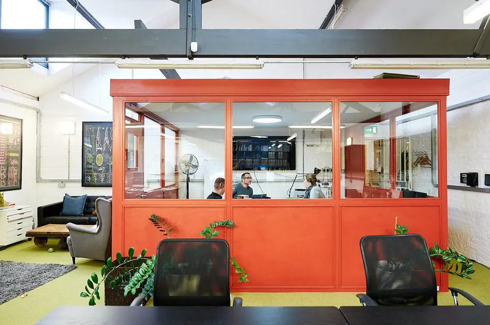 The orange glass meeting room in the middle of the studio