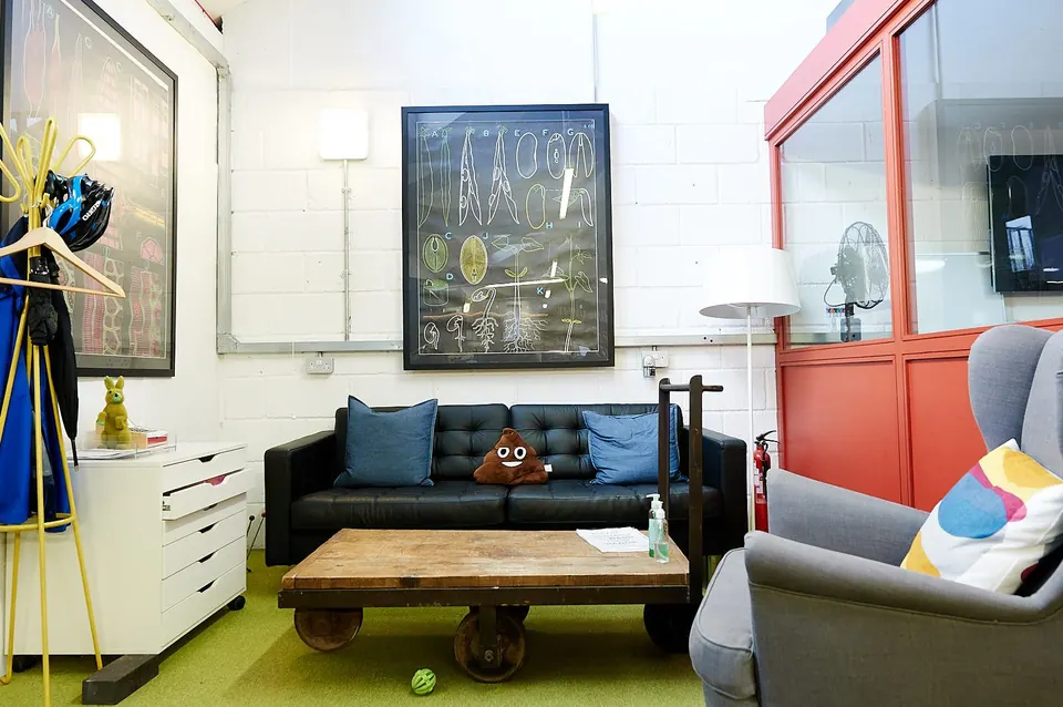 The breakout lounge with a blue sofa and armchair
